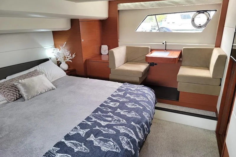 Slide: The Image of Luxurious interior of a 2014 Prestige 550 yacht with modern furnishings and a flat-screen TV. - 11