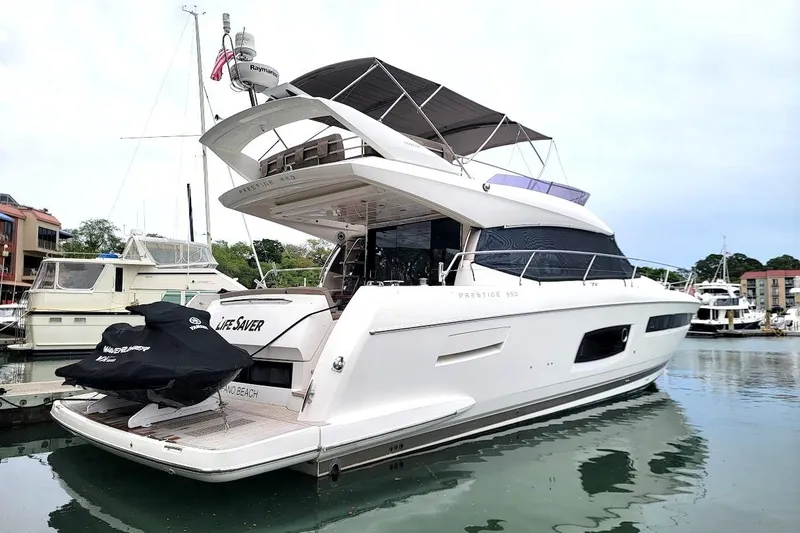 Slide: The Image of Luxurious interior of a 2014 Prestige 550 yacht with elegant seating and modern amenities. - 2