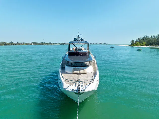 Slide: The Image of Engine room of a 2014 Prestige 550 yacht, showcasing dual engines and mechanical components. - 34
