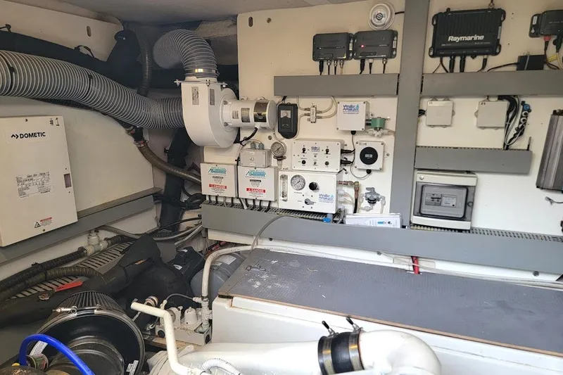 Slide: The Image of Cummins Onan generator in a 2014 Prestige 550 yacht, showcasing control panel and branding. - 37