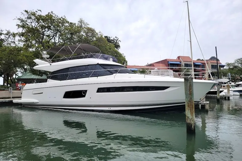 Slide: The Image of Cockpit of 2014 Prestige 550 yacht with Raymarine navigation equipment and steering wheel. - 5