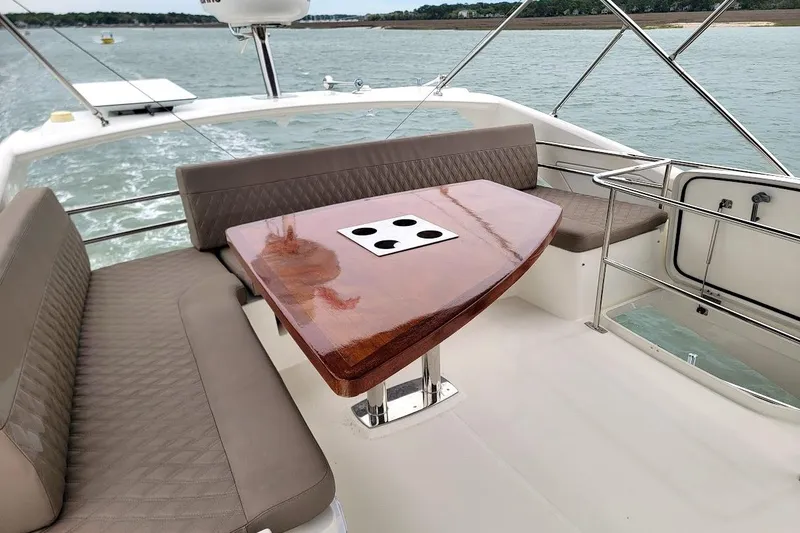 Slide: The Image of Luxury 2014 Prestige 550 yacht docked near waterfront restaurant. - 55