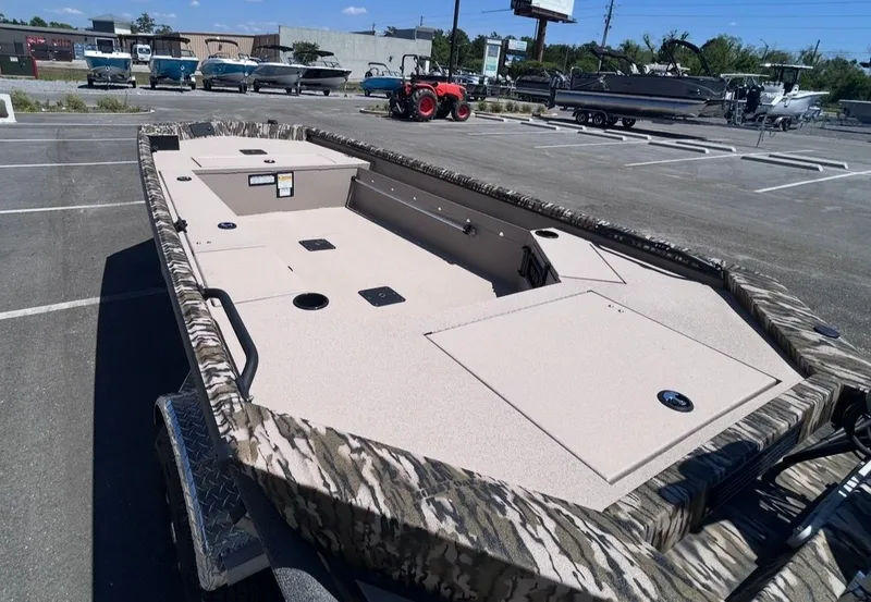 Slide: The Image of Avid 16 Commander 2026 boat displayed in a parking lot. - 11