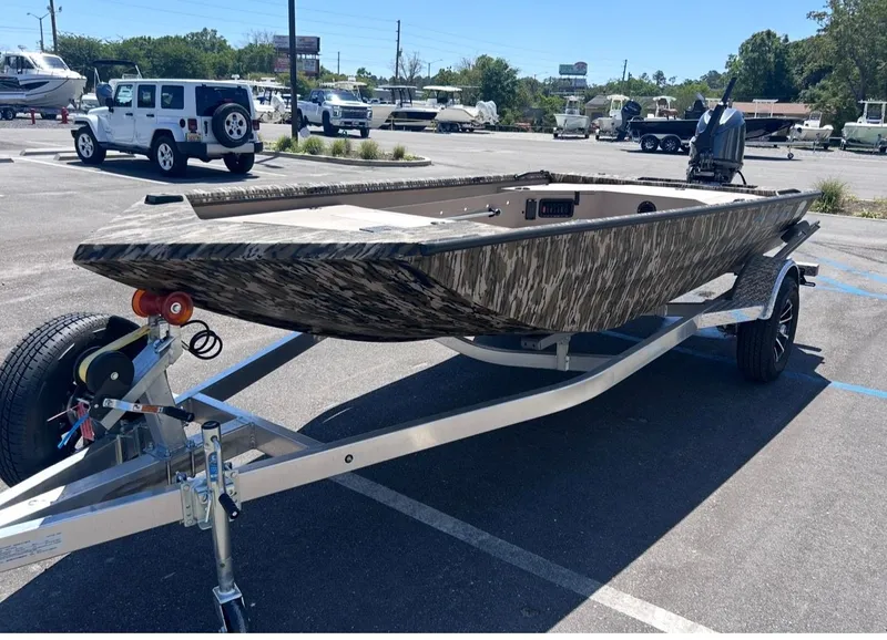 Slide: The Image of Avid 16 Commander 2026 boat on trailer parked outdoors. - 6