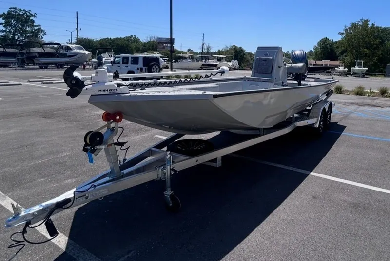 Slide: The Image of Avid 22 Recon 2026 boat on trailer in parking lot. - 11