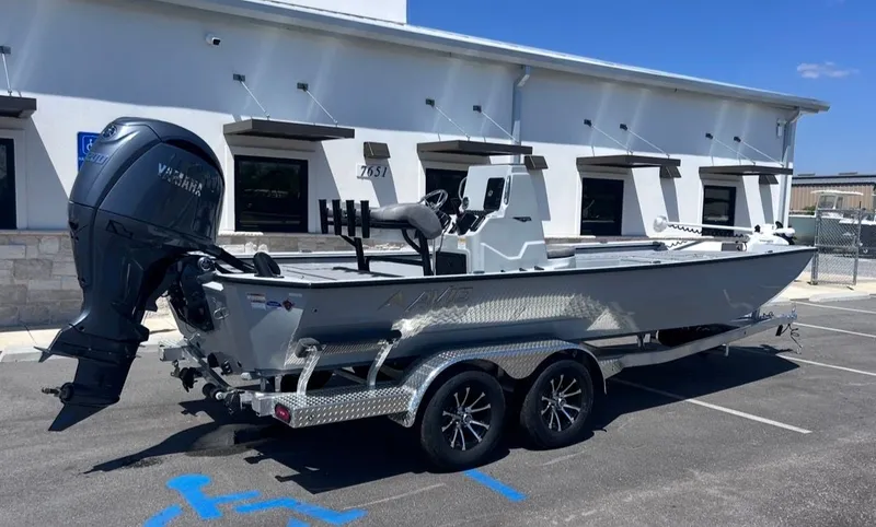 Slide: The Image of Avid 22 Recon 2026 boat on trailer in front of building. - 3