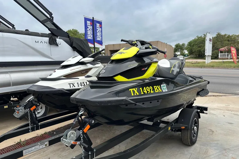 Slide: The Image of 2012 Seadoo GTX-IS-LTD jet ski on trailer, parked outdoors. - 2
