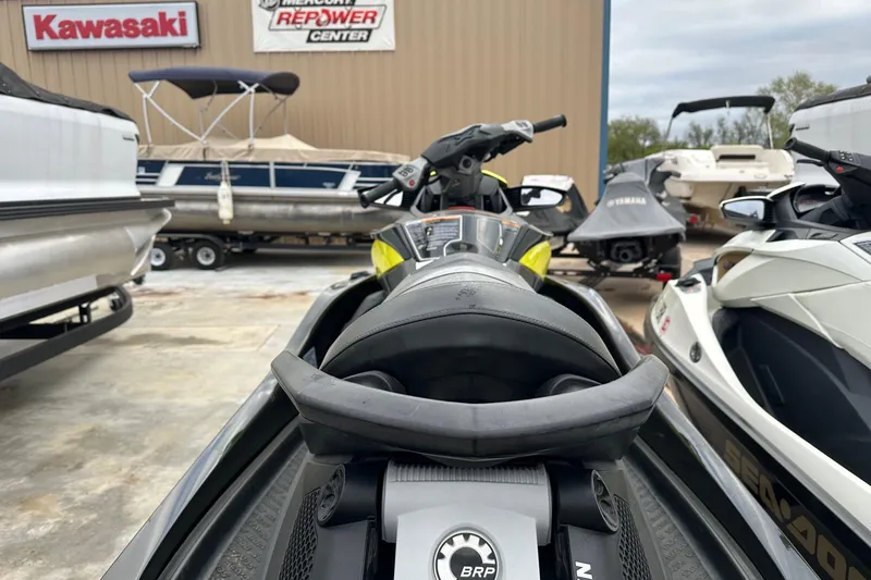 Slide: The Image of 2012 Seadoo GTX-IS-LTD jet ski parked at a dealership with boats in the background. - 4