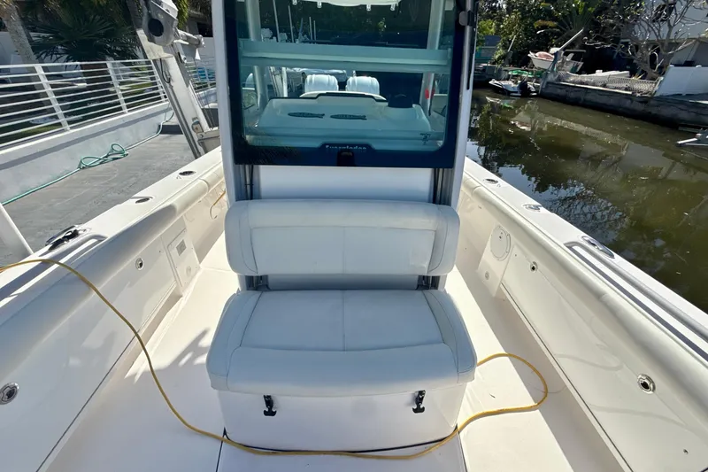 Slide: The Image of 2021 Everglades 273 Center Console boat interior with seating and console view. - 16