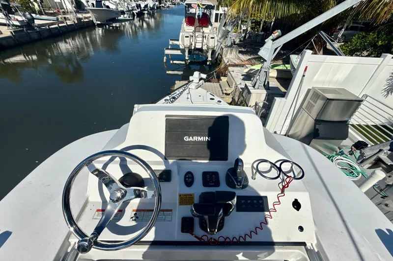 Slide: The Image of 2021 Everglades 273 Center Console boat helm with Garmin navigation system. - 21