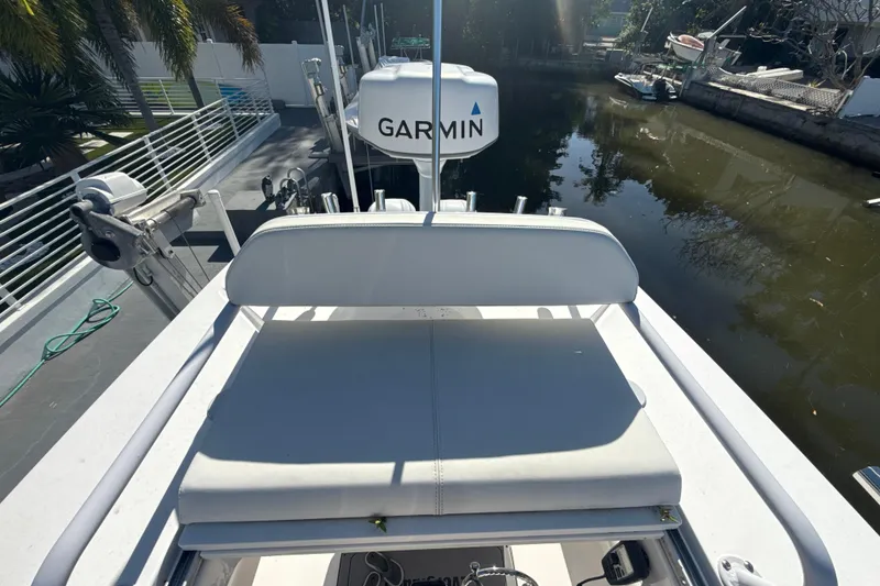 Slide: The Image of 2021 Everglades 273 Center Console boat with Garmin equipment, docked by a canal. - 22