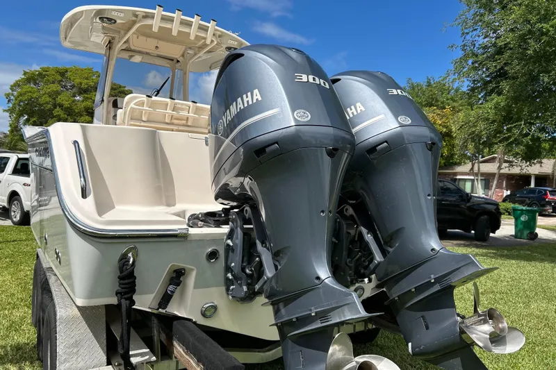 Slide: The Image of 2021 Grady-White Canyon 271 FS boat with dual Yamaha 300 engines on trailer. - 4