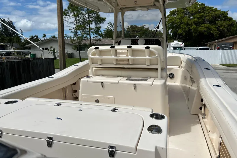 Slide: The Image of 2021 Grady-White Canyon 271 FS boat interior with seating and storage compartments. - 5