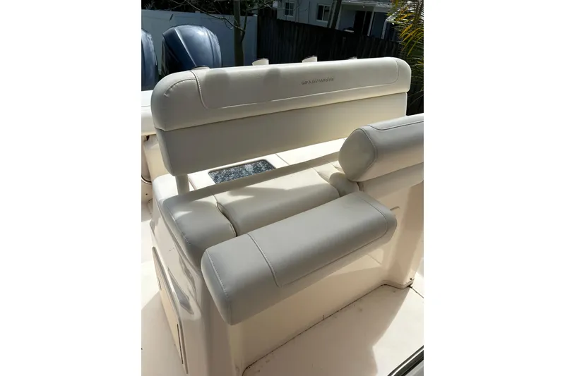 Slide: The Image of 2021 Grady-White Canyon 271 FS boat seat, featuring plush white upholstery. - 7