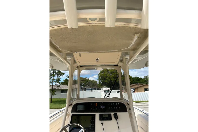 Slide: The Image of 2021 Grady-White Canyon 271 FS boat console with steering wheel and electronics. - 9