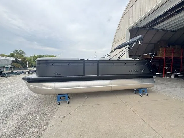 The Image of Viaggio V20C Tri-Toon 2026 pontoon boat outside warehouse. - 1