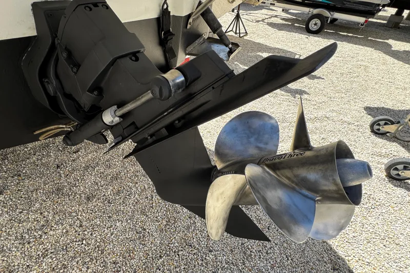 Slide: The Image of 2004 Crownline 250 CR boat with sleek design and black canopy. - 10