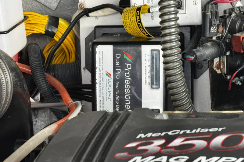 Slide: The Image of Engine compartment of a 2004 Crownline 250 CR boat, showing belts and pulleys. - 106