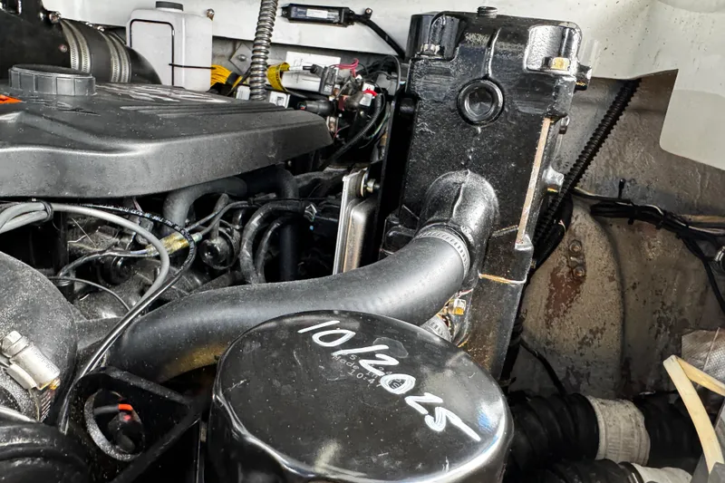 Slide: The Image of Engine compartment of a 2004 Crownline 250 CR boat, showing detailed components. - 111