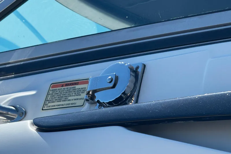 Slide: The Image of 2004 Crownline 250 CR boat on Venture custom trailer, parked on gravel. - 14