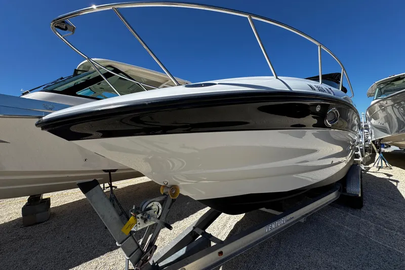 Slide: The Image of Rear view of a 2004 Crownline 250 CR boat showing propeller and stern details. - 15