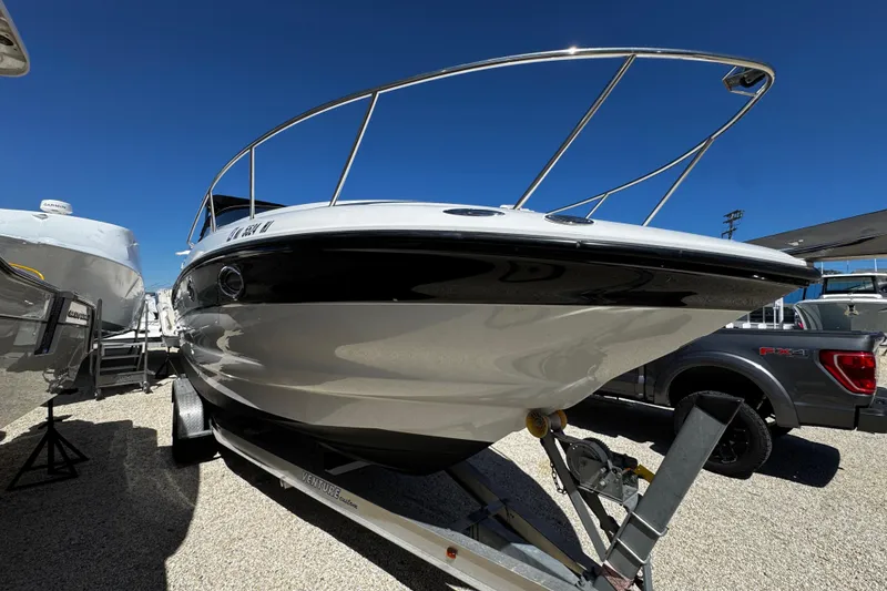 Slide: The Image of Propeller of a 2004 Crownline 250 CR boat on gravel surface. - 16