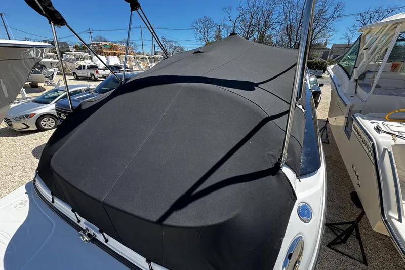 Slide: The Image of Close-up of a 2004 Crownline 250 CR boat propeller and outdrive on gravel. - 17