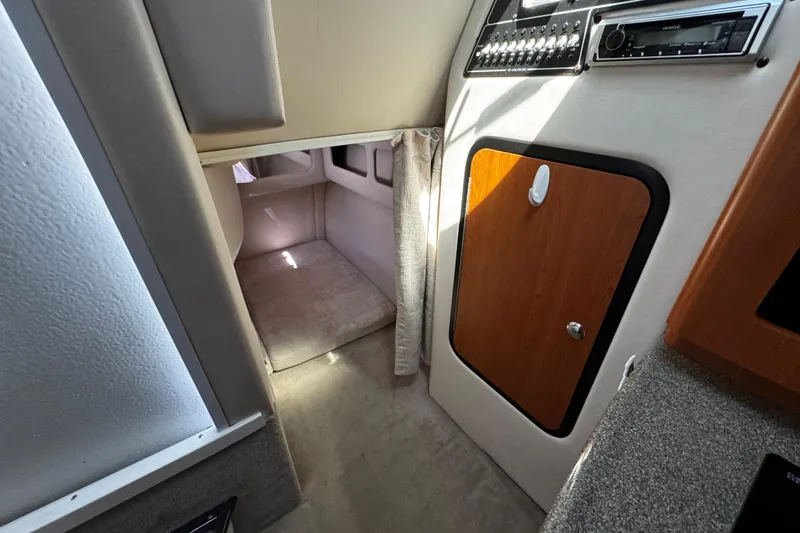 Slide: The Image of 2004 Crownline 250 CR boat on trailer, side view under clear blue sky. - 20