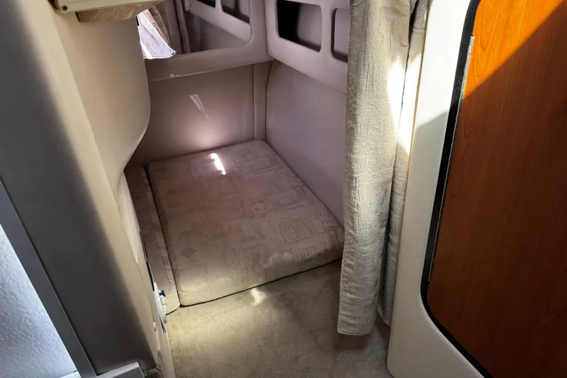 Slide: The Image of Close-up of a 2004 Crownline 250 CR boat's power inlet with warning label. - 21