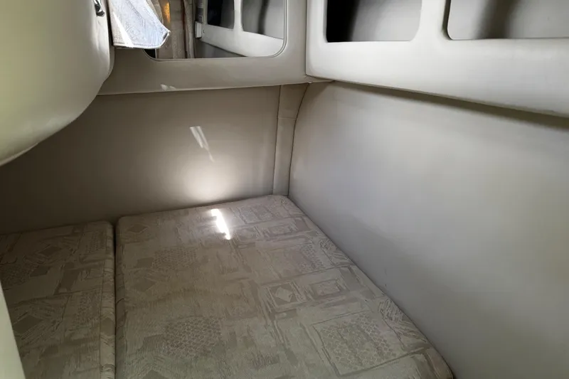 Slide: The Image of 2004 Crownline 250 CR boat on trailer under clear blue sky. - 22