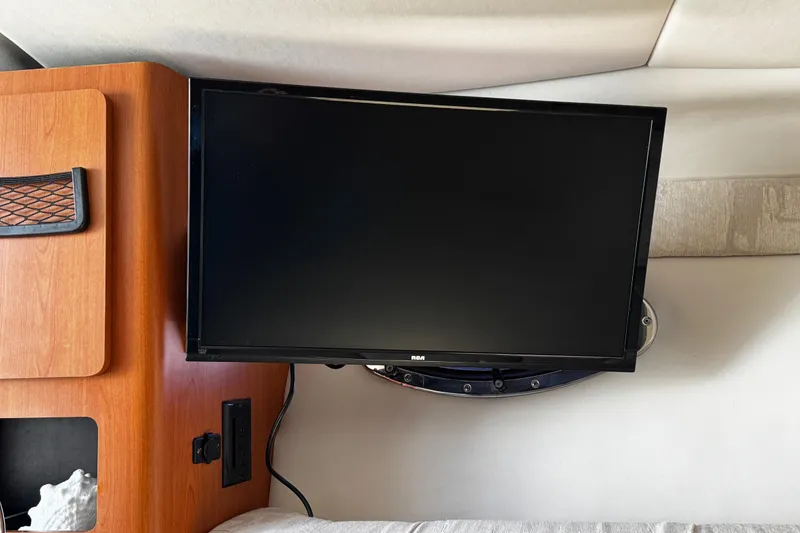 Slide: The Image of Control panel of a 2004 Crownline 250 CR boat, featuring various switches and a voltmeter. - 31