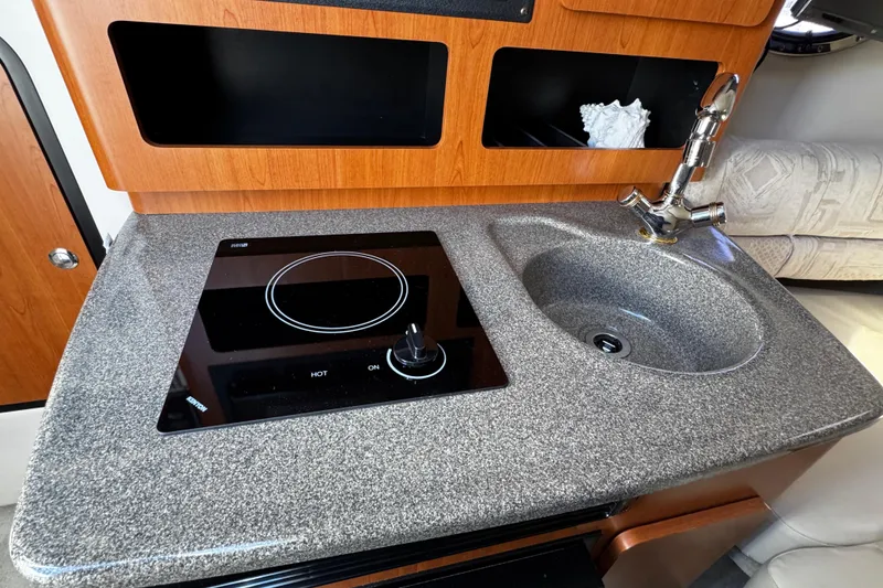 Slide: The Image of Flat-screen TV mounted inside a 2004 Crownline 250 CR boat cabin. - 38