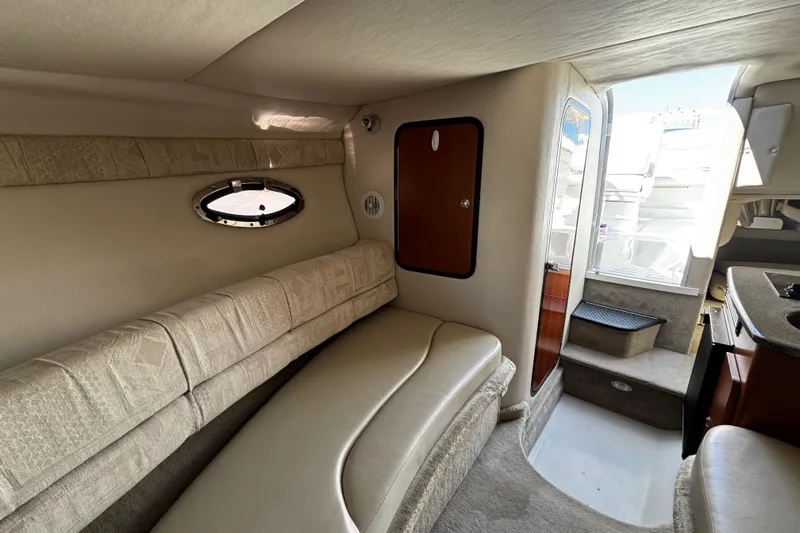 Slide: The Image of 2004 Crownline 250 CR boat kitchenette with stove and sink. - 45