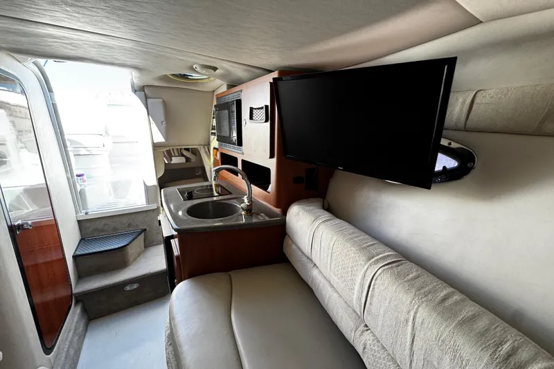 Slide: The Image of Built-in microwave in 2004 Crownline 250 CR boat interior. - 46