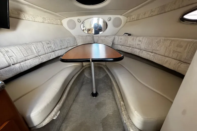 Slide: The Image of Interior of 2004 Crownline 250 CR boat with plush seating and elegant design. - 50