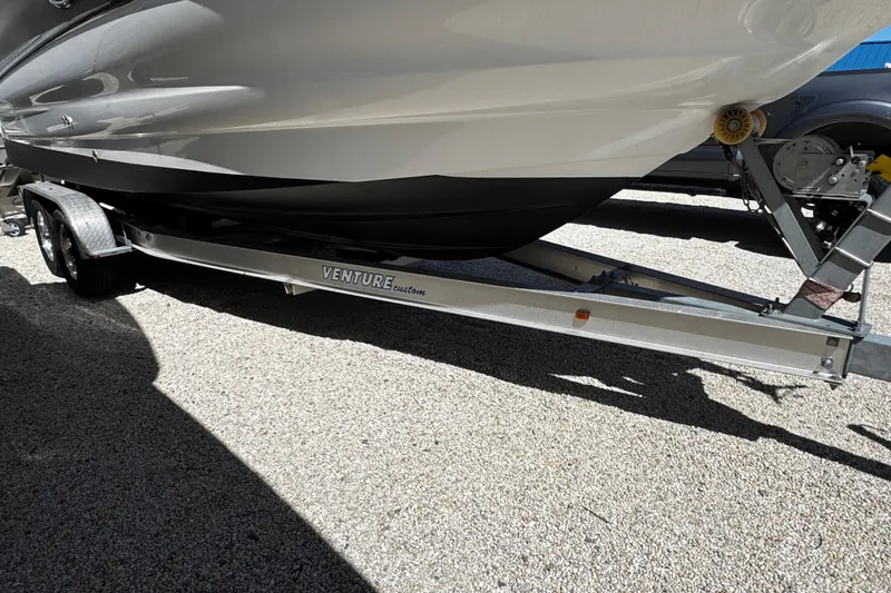 Slide: The Image of 2004 Crownline 250 CR boat on trailer, covered and parked outdoors. - 6