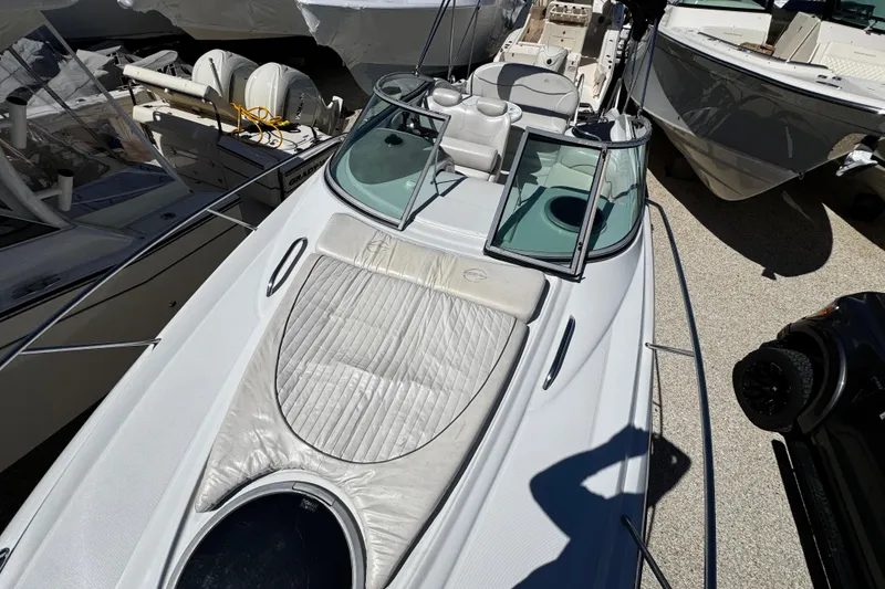 Slide: The Image of 2004 Crownline 250 CR cabin interior with kitchenette and seating area. - 60