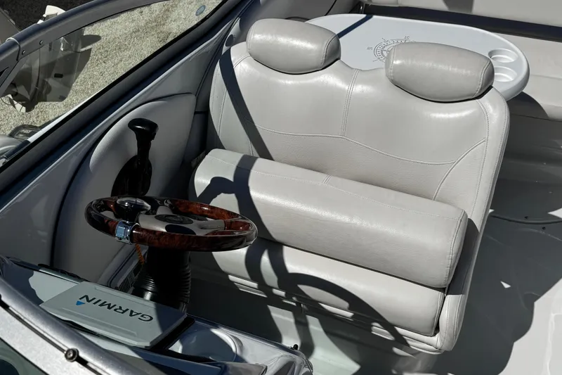 Slide: The Image of Anchor winch on 2004 Crownline 250 CR boat deck with chain and rope. - 63