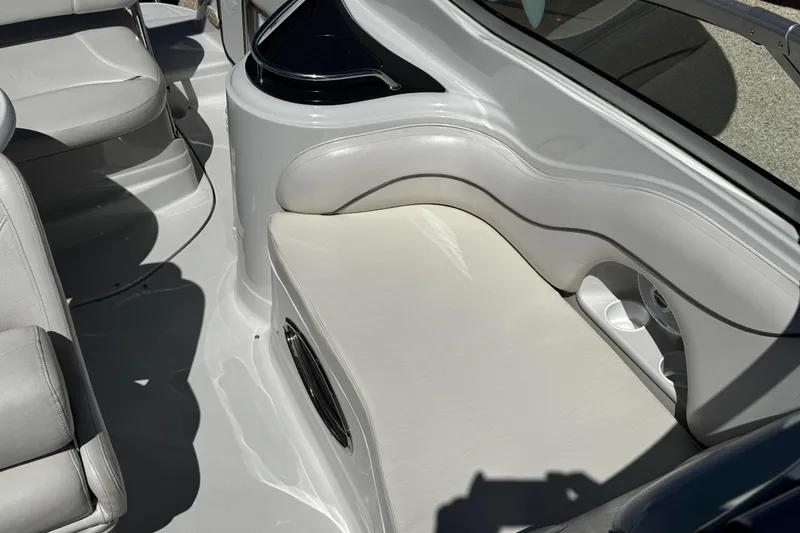 Slide: The Image of 2004 Crownline 250 CR boat anchor and chain mechanism on deck. - 64