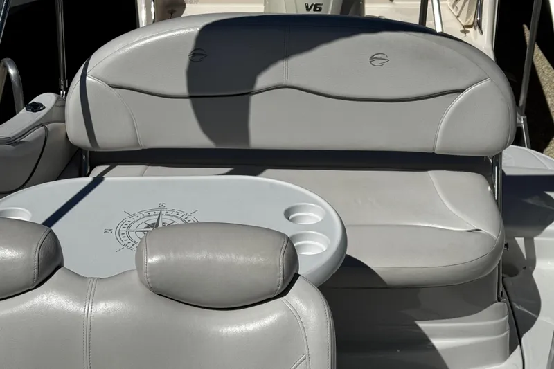 Slide: The Image of 2004 Crownline 250 CR boat on display, surrounded by other vessels. - 65