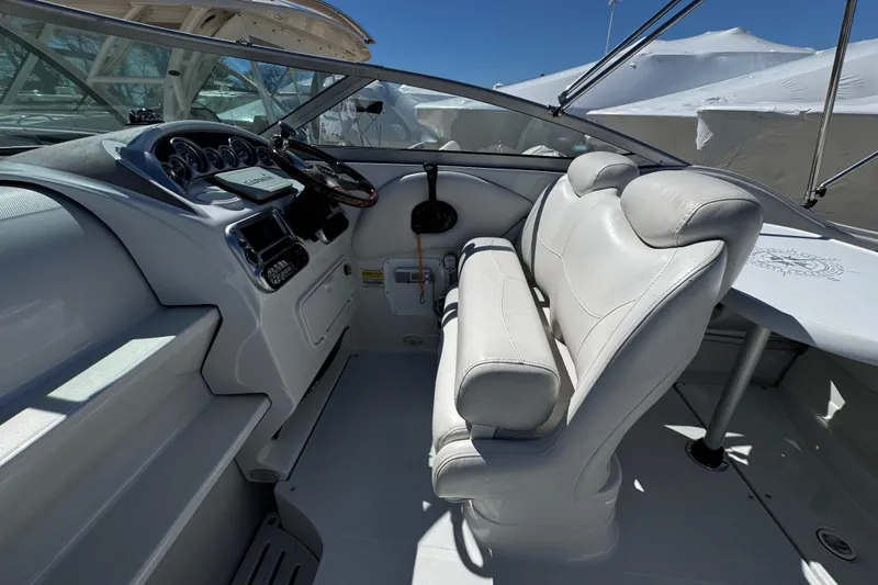 Slide: The Image of 2004 Crownline 250 CR boat interior with seating and windshield, viewed from above. - 68