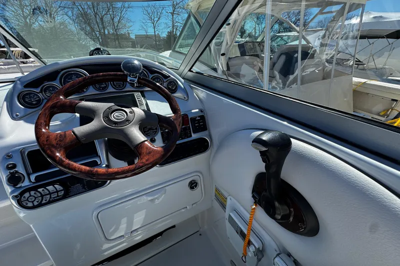 Slide: The Image of Compass on 2004 Crownline 250 CR boat dashboard, featuring Ritchie brand. - 81