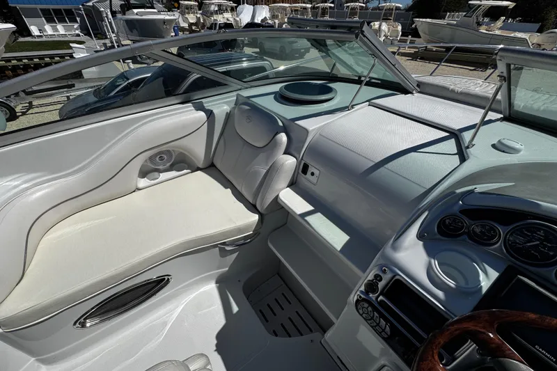 Slide: The Image of Control panel of a 2004 Crownline 250 CR boat with horn and trim tabs. - 82