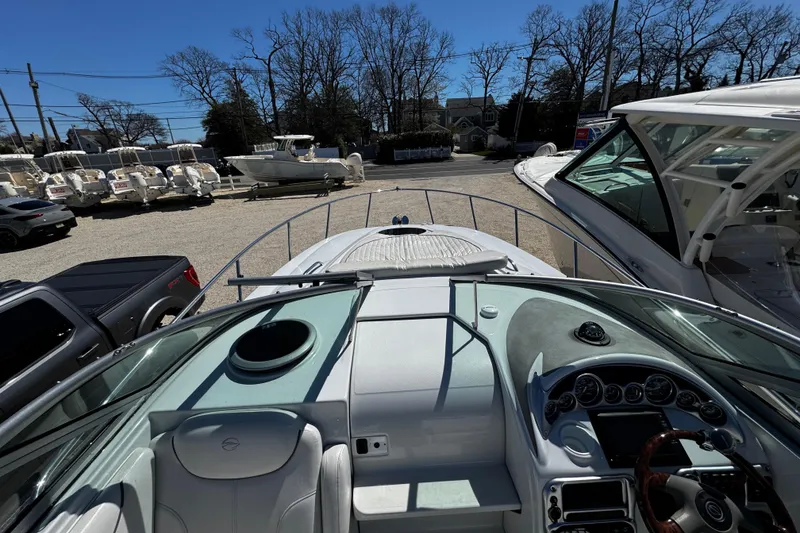 Slide: The Image of Control panel of a 2004 Crownline 250 CR boat with audio and bilge switches. - 84