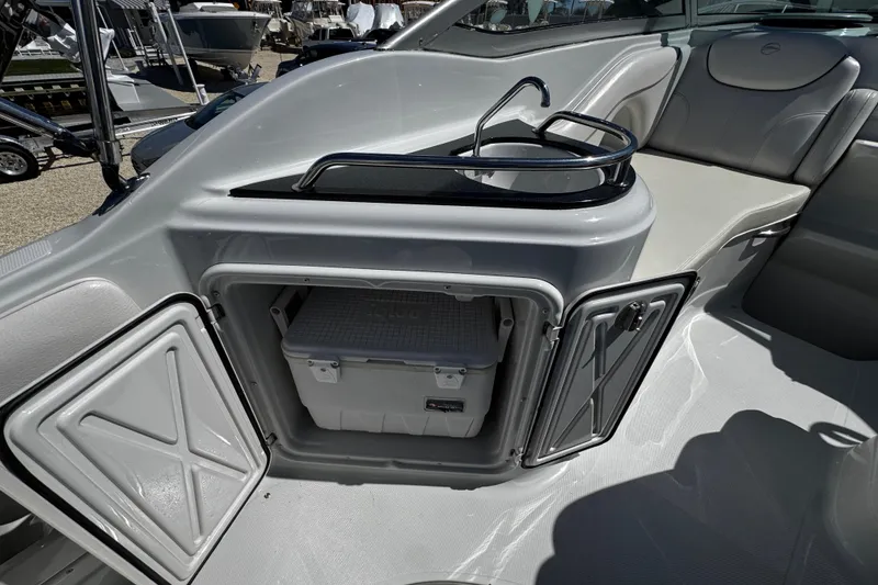 Slide: The Image of 2004 Crownline 250 CR boat dashboard with gauges and steering wheel. - 85