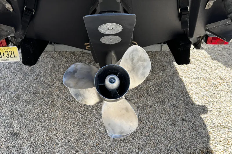 Slide: The Image of 2004 Crownline 250 CR boat with black canopy and sleek design. - 9