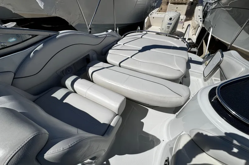 Slide: The Image of 2004 Crownline 250 CR boat interior with sink and storage compartment. - 92
