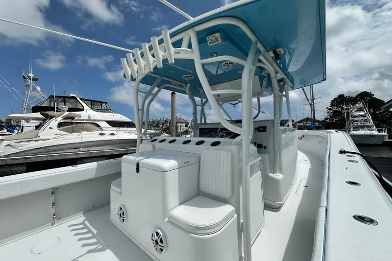 Slide: The Image of 2009 Yellowfin 42 Offshore boat interior with helm station, docked at marina. - 10