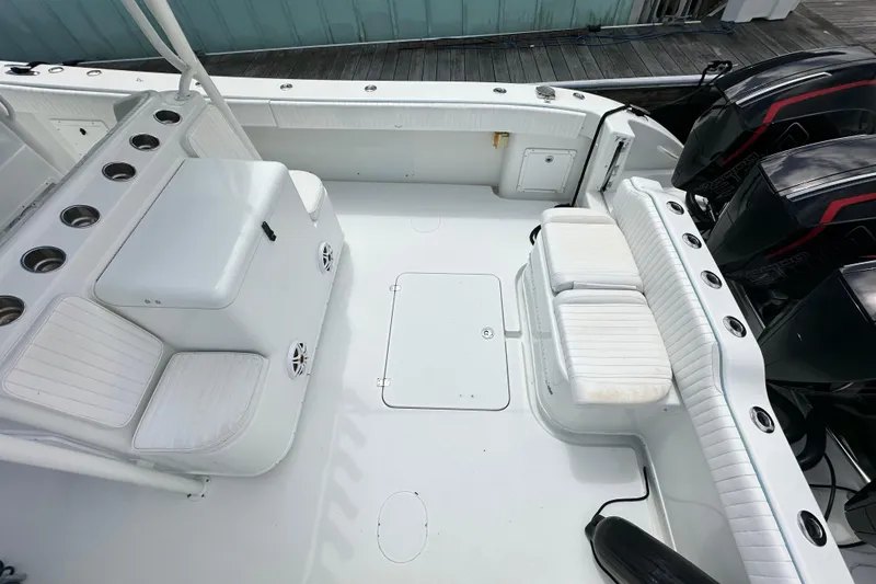 Slide: The Image of 2009 Yellowfin 42 Offshore boat deck with seating and outboard motors. - 27