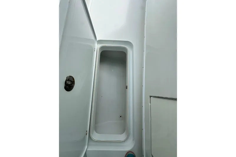 Slide: The Image of Open storage compartment on a 2009 Yellowfin 42 Offshore boat. - 41
